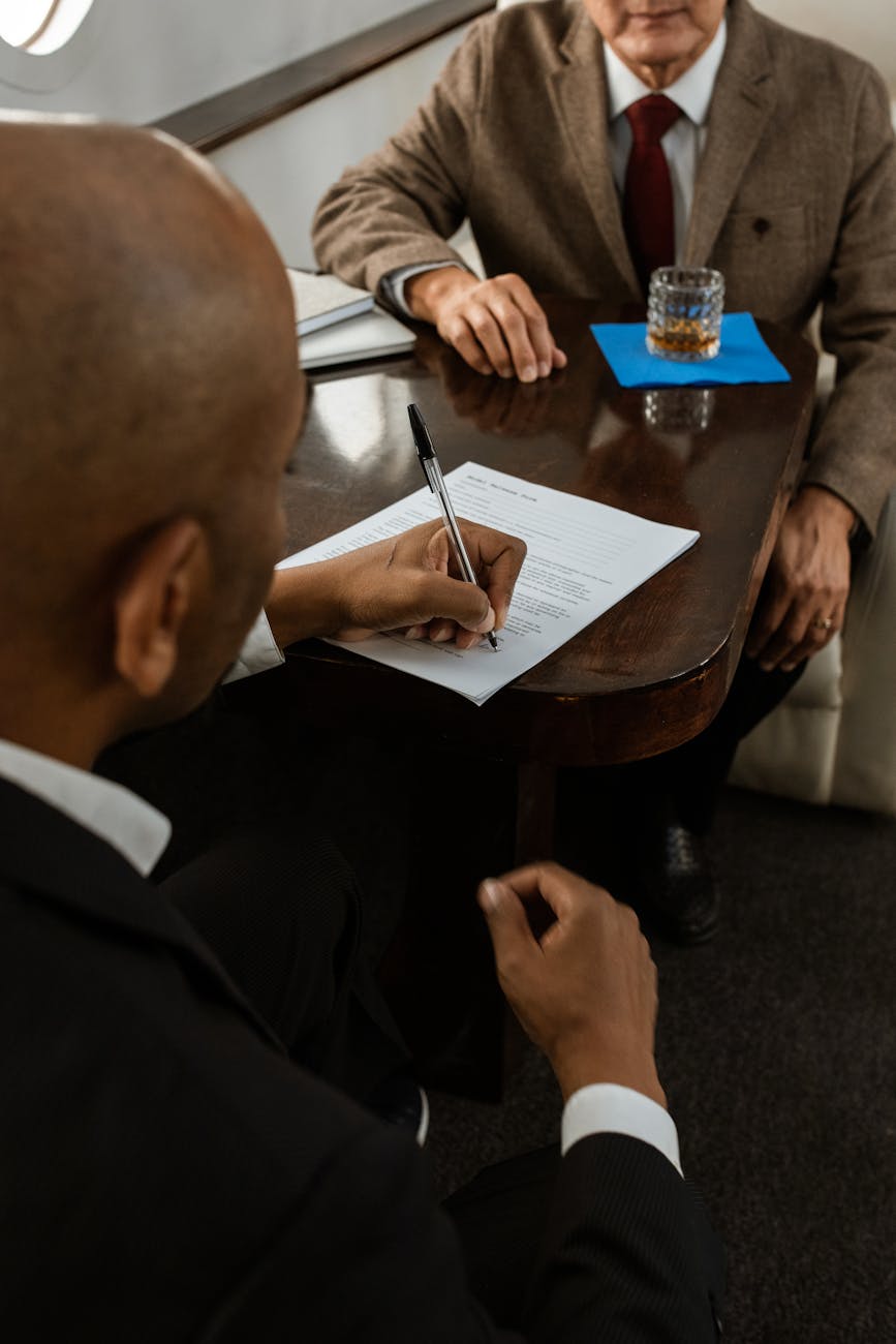 a businessperson signing a contract